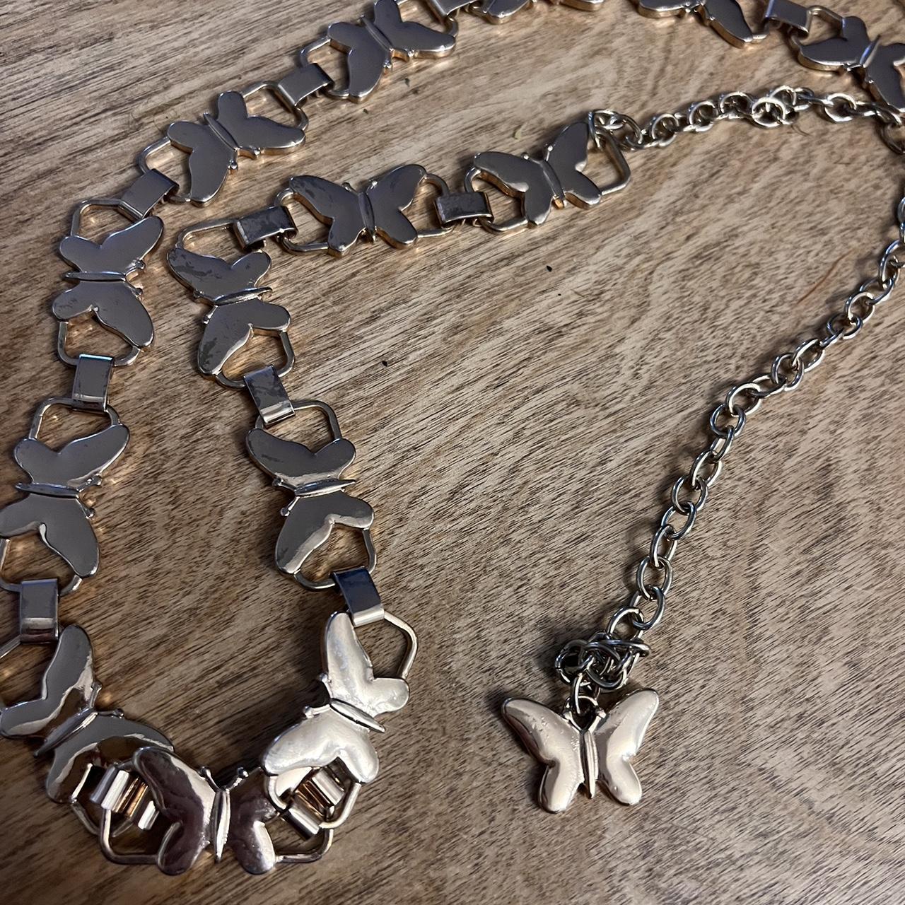 Gold butterfly chain belt Slight discoloration on... Depop