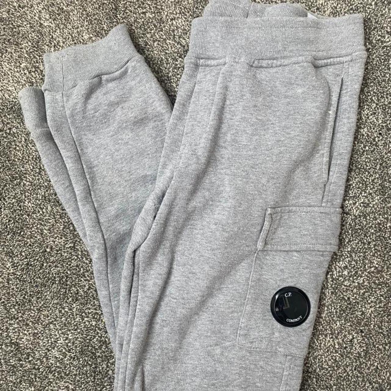 grey CP company tracksuit age 10 comes up slightly big - Depop