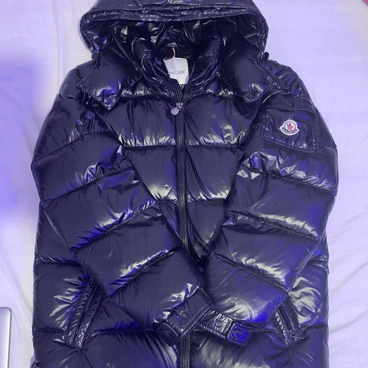 Black moncler coat good condition got a little hole... - Depop