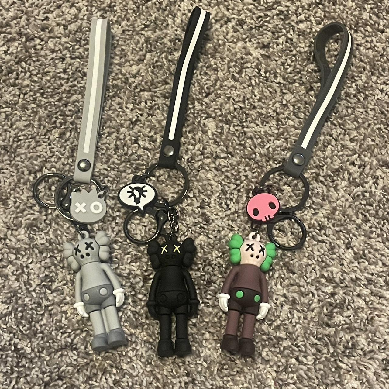 Kaws figure keychains $12 for each or $33 for all... - Depop