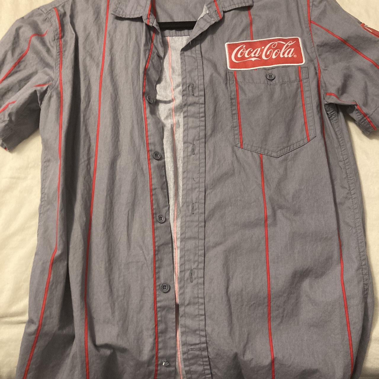 Coke Dress shirt only flaw is button on bottom... - Depop