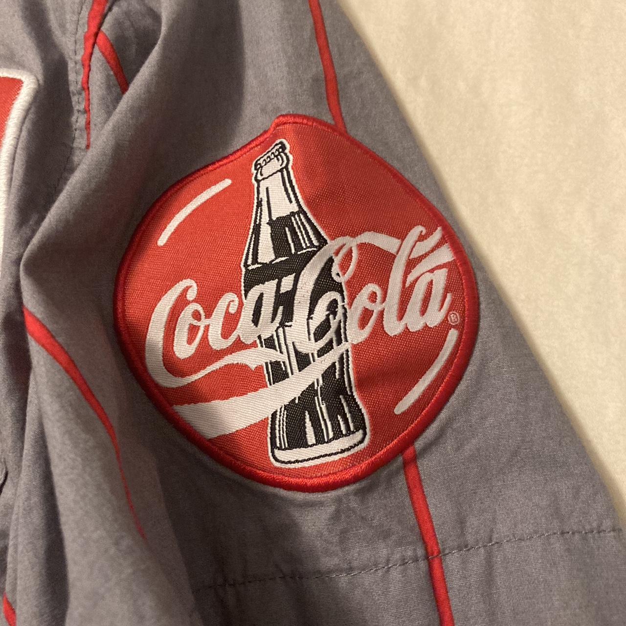 Coke Dress shirt only flaw is button on bottom... - Depop