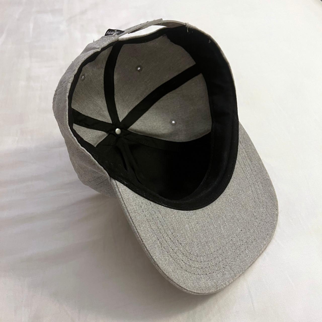 grey adjustable snapback cap with black and white... - Depop