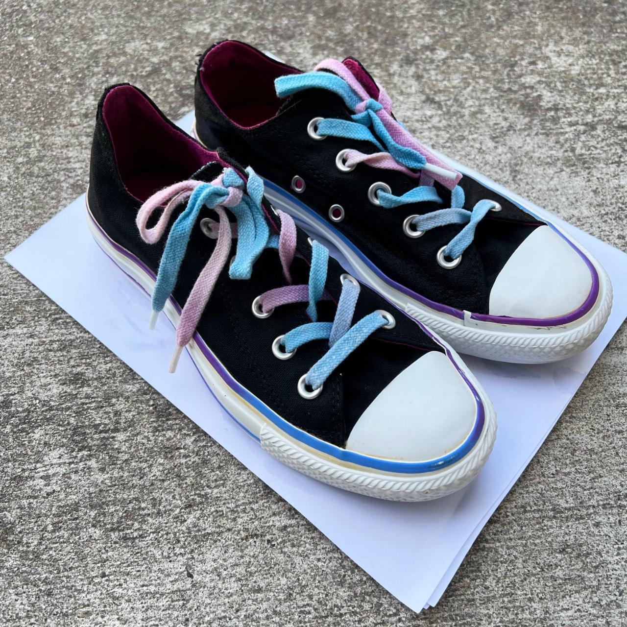 black converse low tops with subtle pink blue