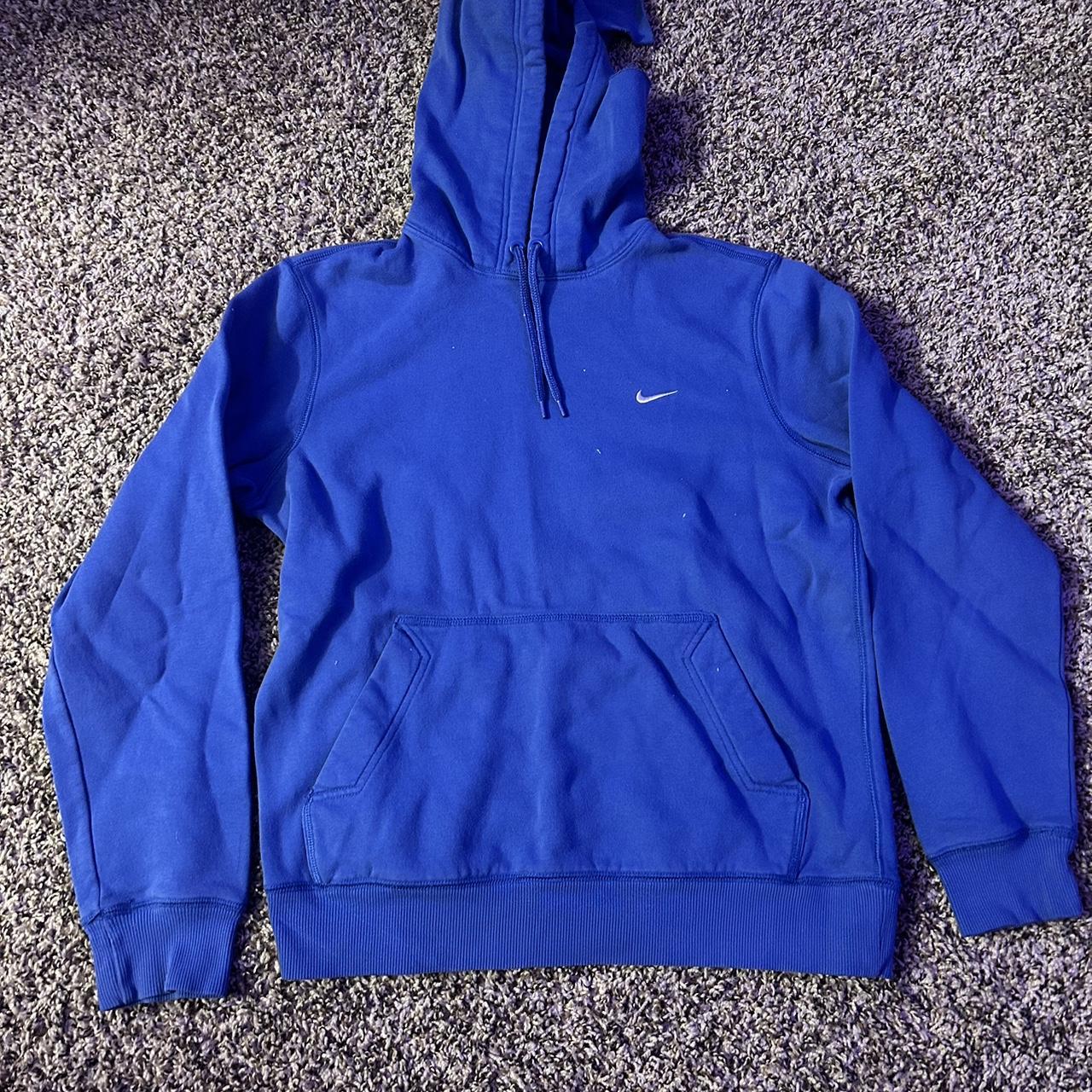 white nike hoodie with blue swoosh