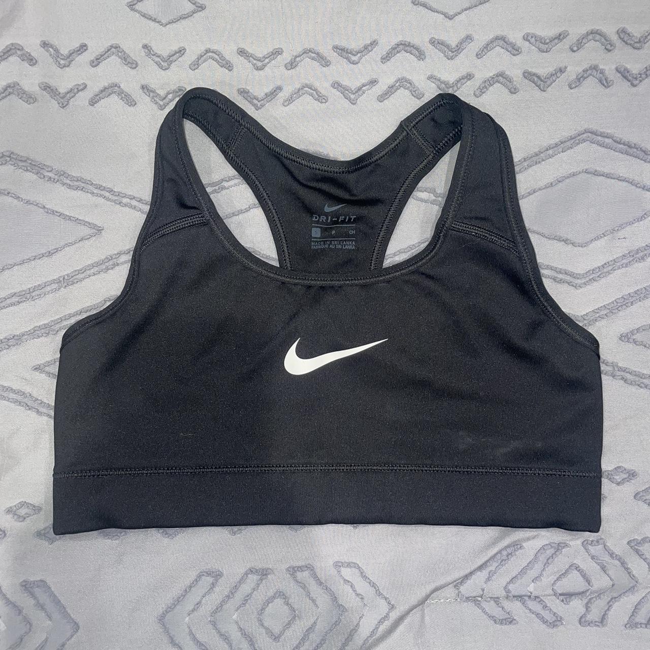 Classic Black nike sports bra with white swoosh.... - Depop