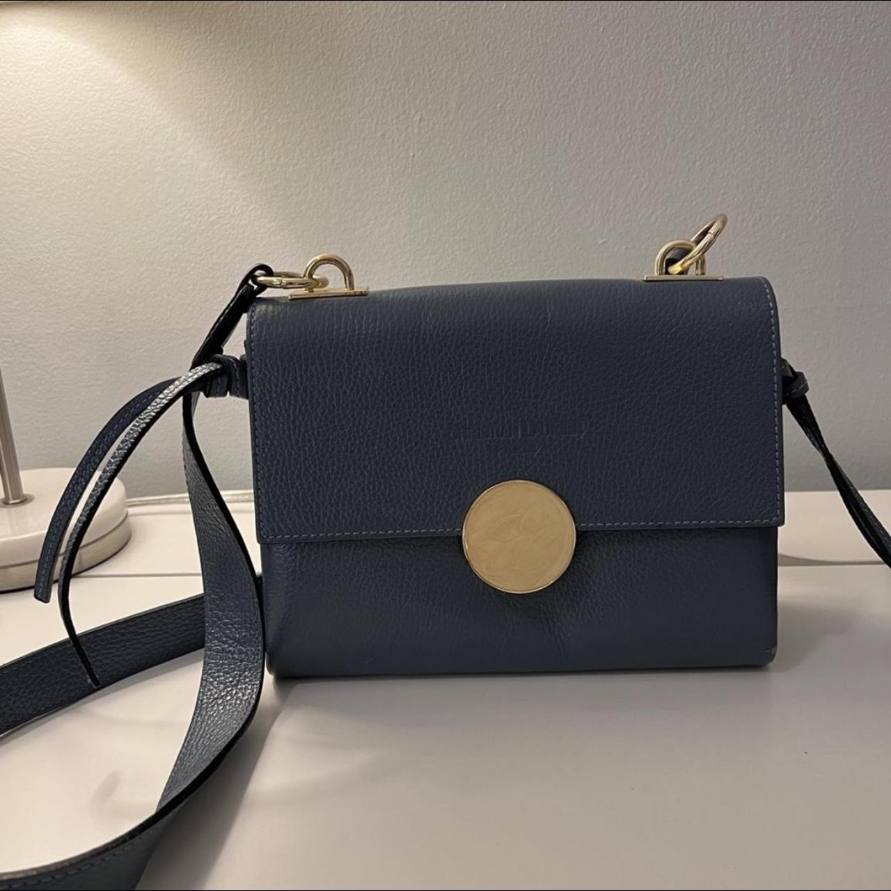 Circular push discount lock crossbody bag