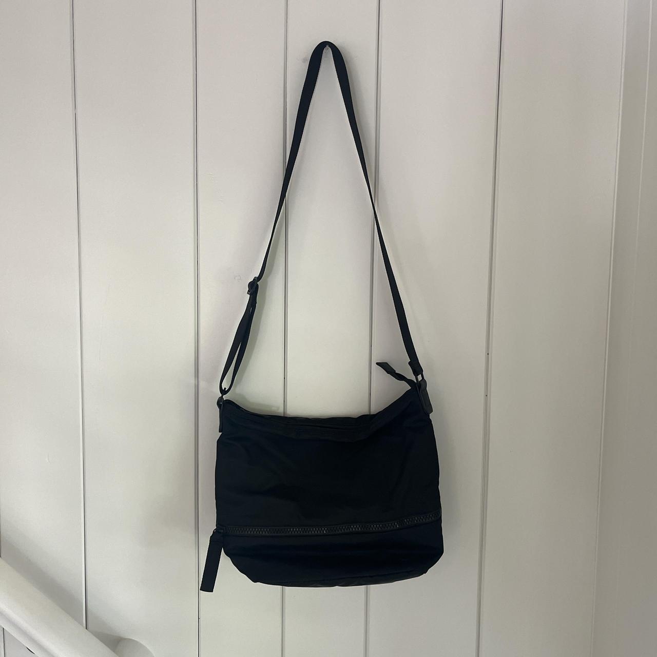 Lululemon black satchel. Small mark on the back - Depop