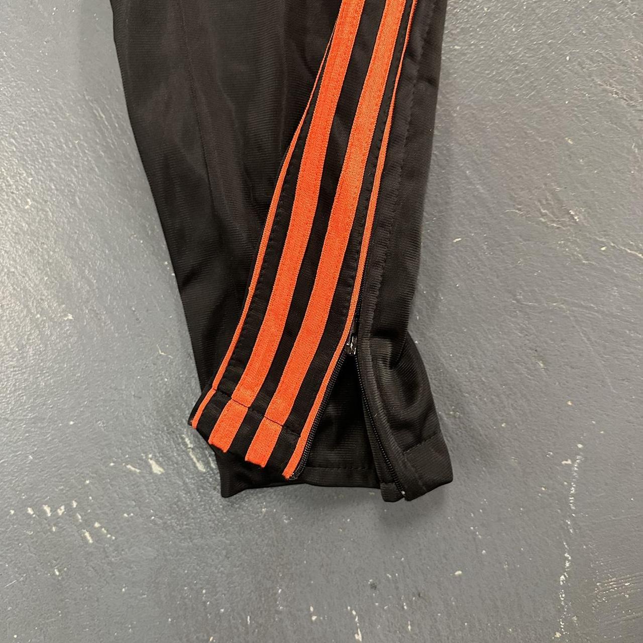 Baggy Black & Orange Active Joe Sweatpants Size... Depop