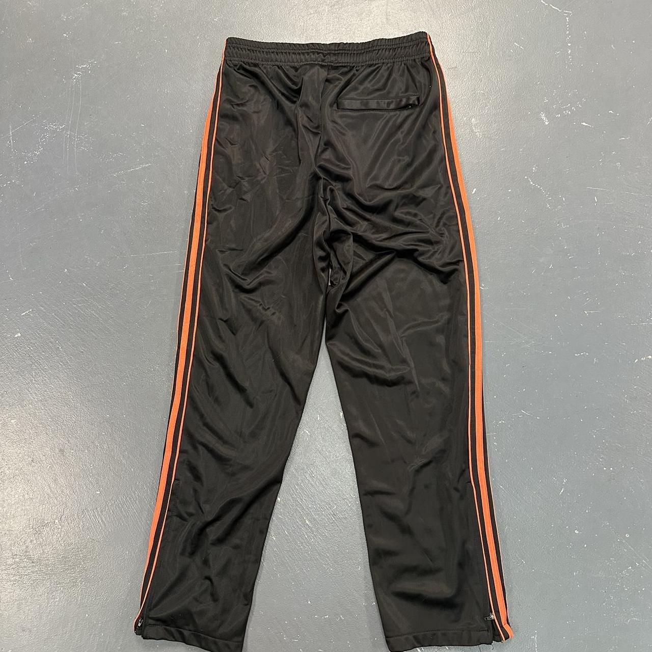 Baggy Black & Orange Active Joe Sweatpants Size... Depop