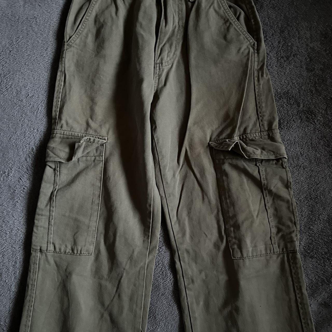 green cargos (they have a bleach stain at the bottom) - Depop