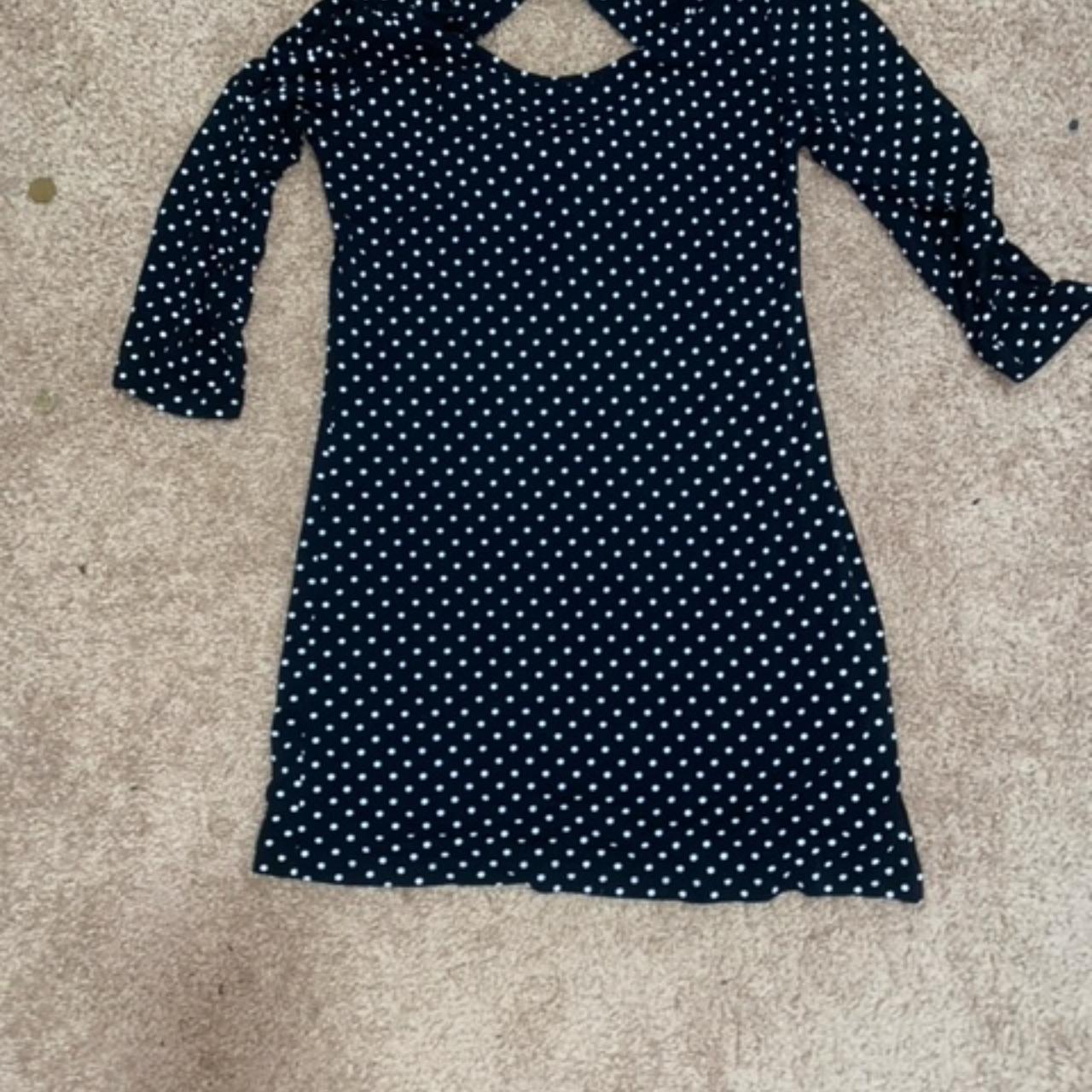 A navy-blue long-sleeved dress that has white small... - Depop