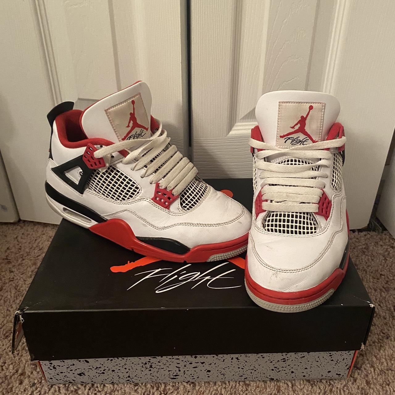 Air Jordan 4 Fire Red. Small scratch marks on the