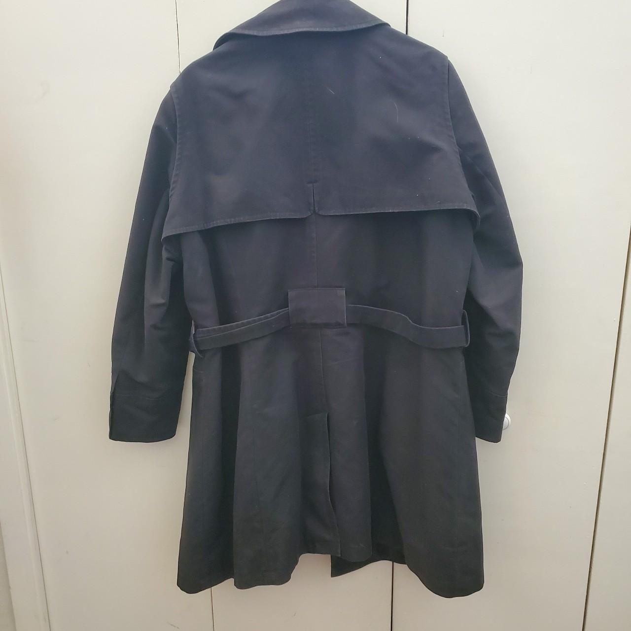 A Marks and Spencer black trench coat in Good Used... - Depop