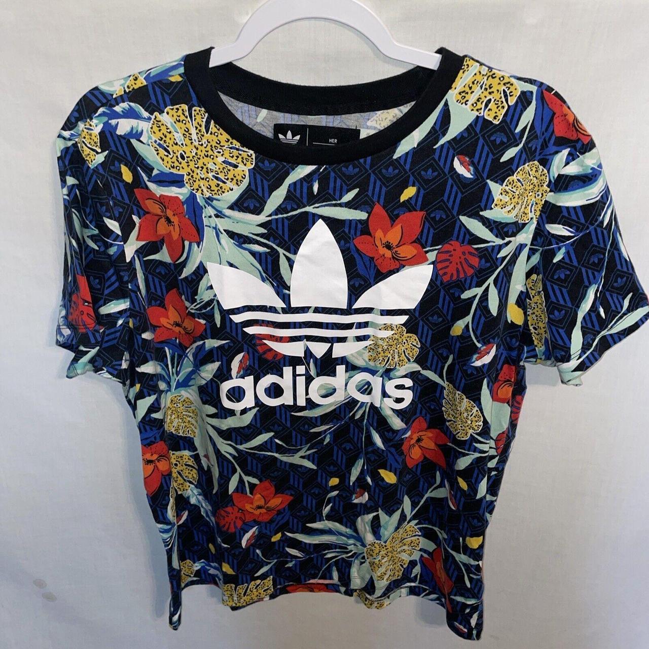 This womens blue floral Adidas casual T shirt is in. Depop