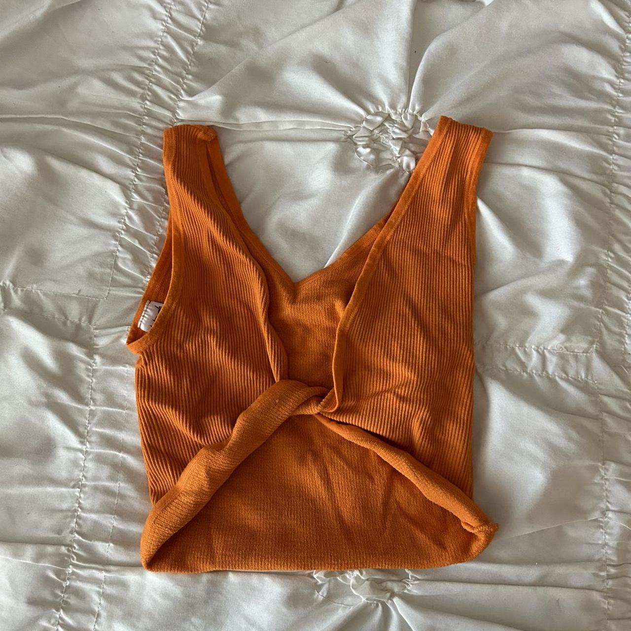 orange twist front crop top from urban outfitters.... Depop