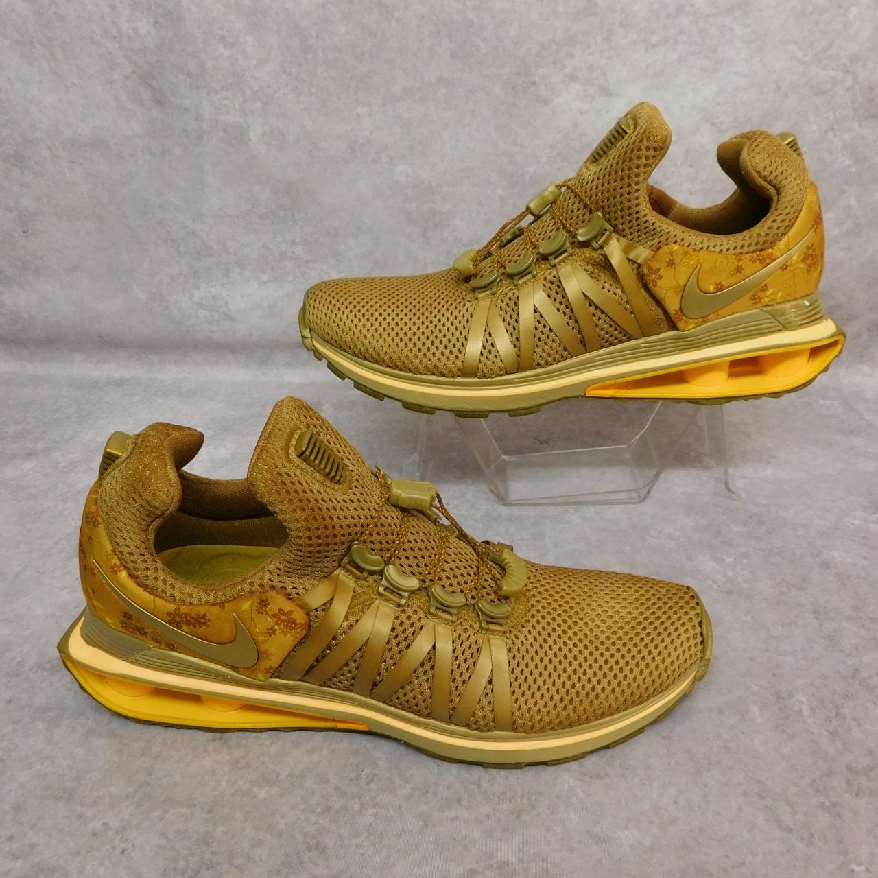 Gold nike shox womens best sale