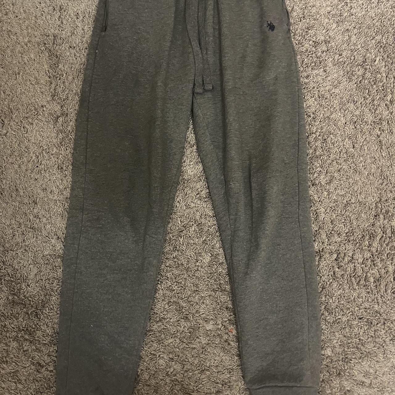 Dark grey polo sweat pants, have a hole in the back... - Depop