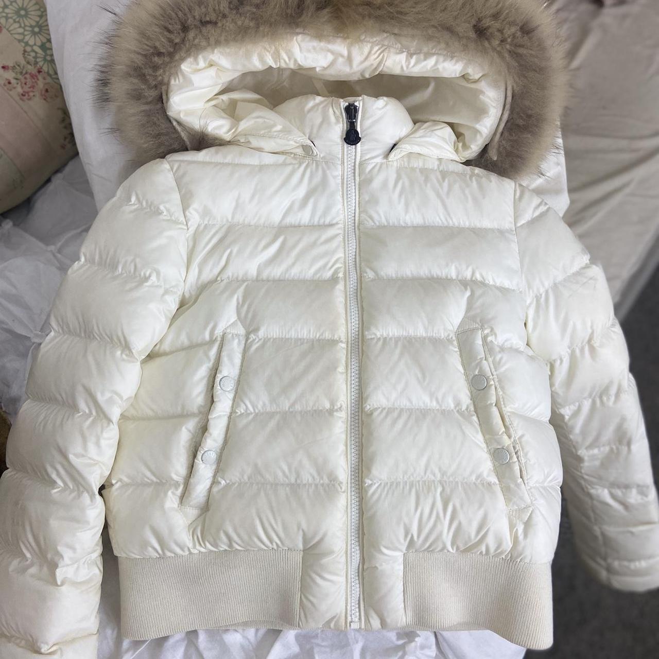 white / cream moncler coat has a few fake tan stains... - Depop