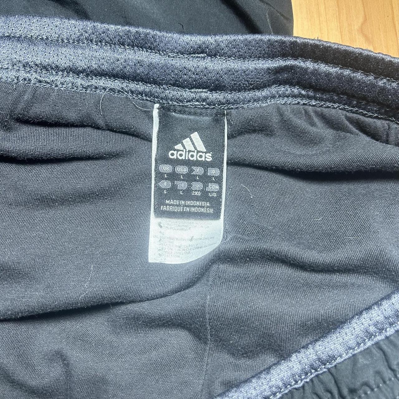 Adidas Track Pants that feature a baggy and sleek... - Depop