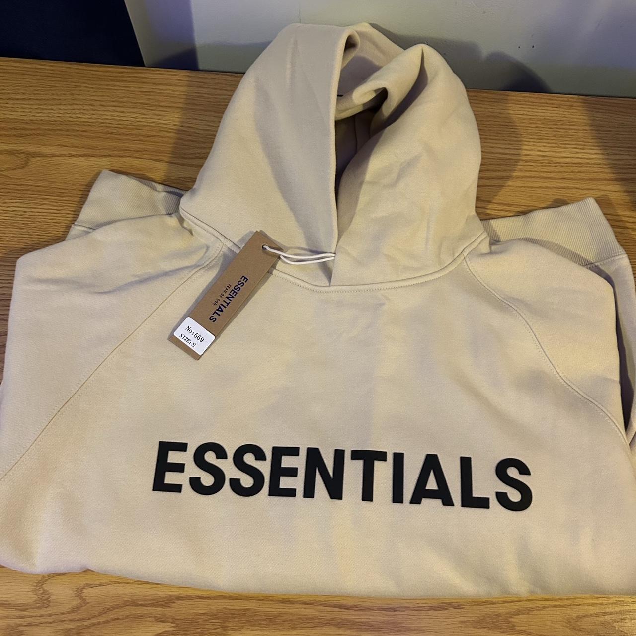 Fear of god essentials cream outlet hoodie