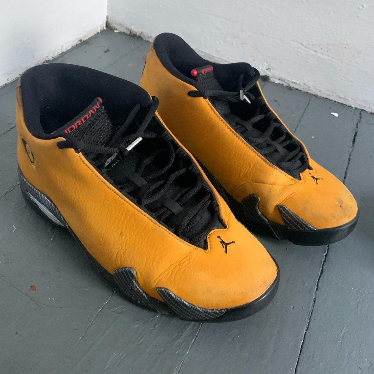 Black and yellow jordan cheap 14s