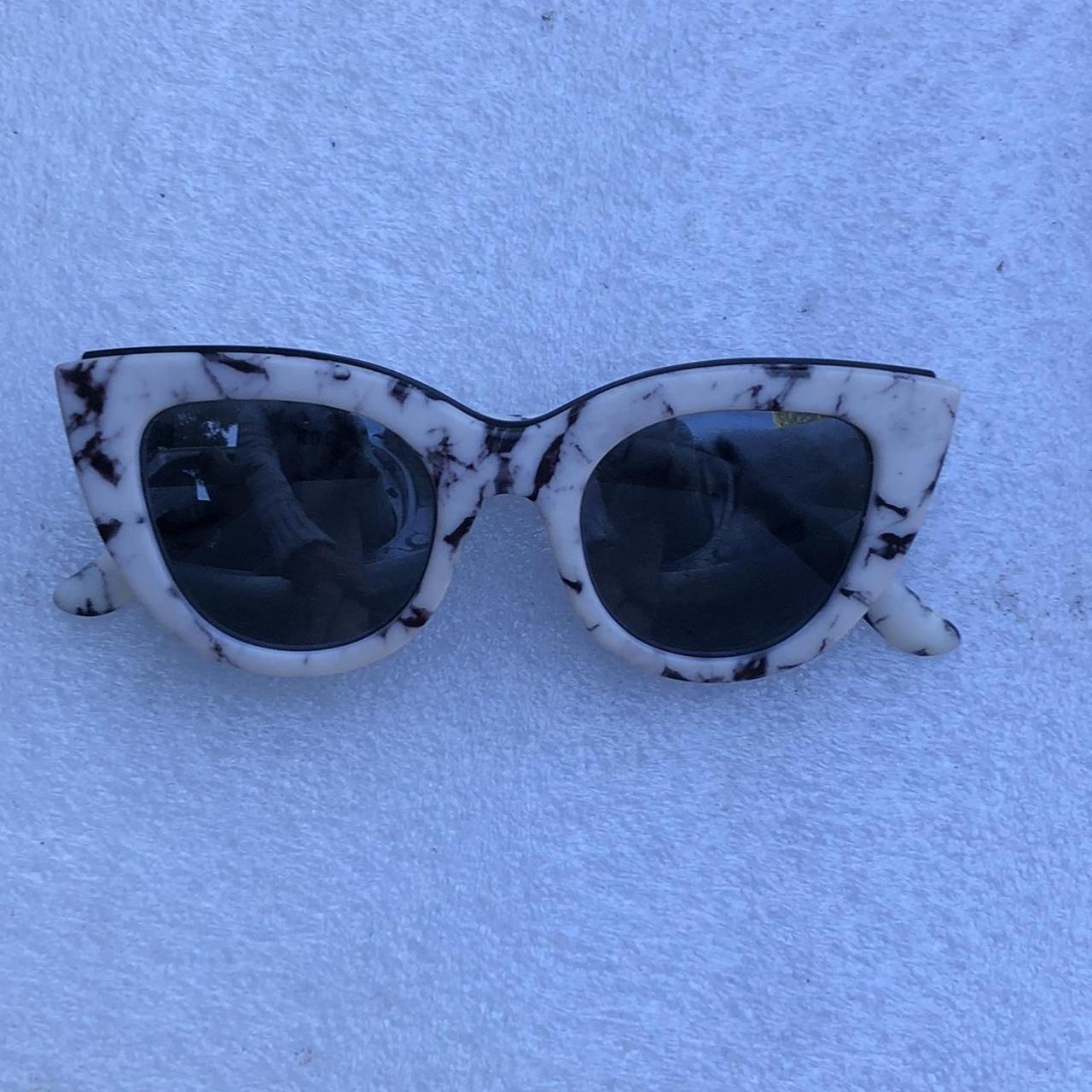 ROC marbled black and white sunglasses Perfect used. Depop