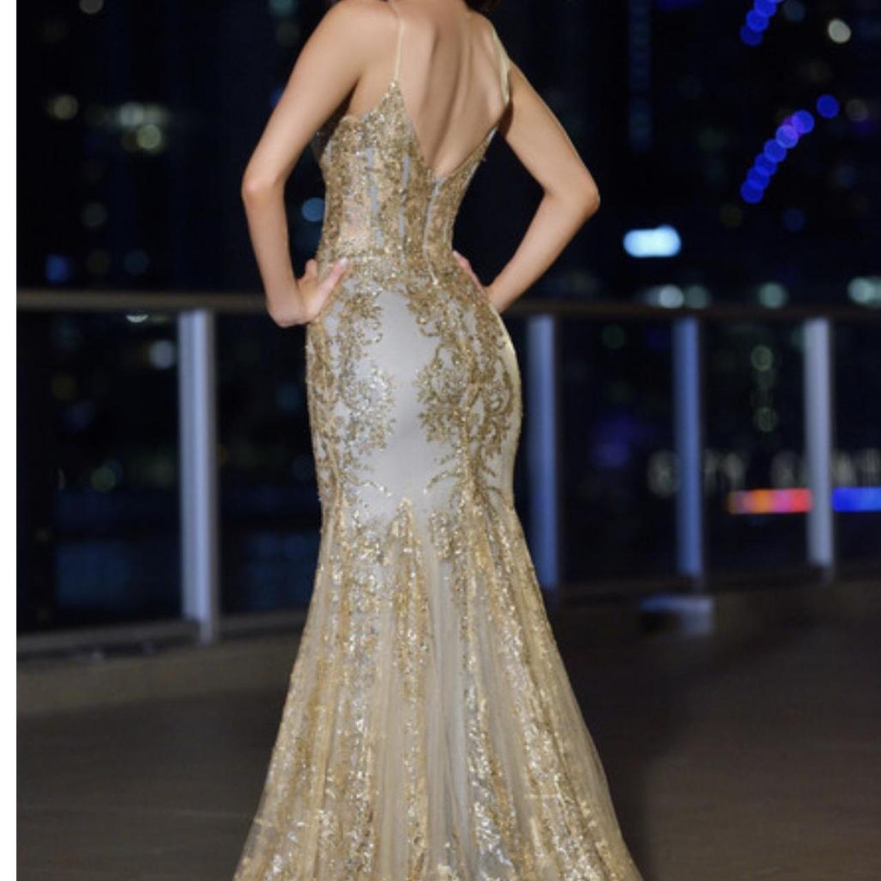 lady black tie gold dress