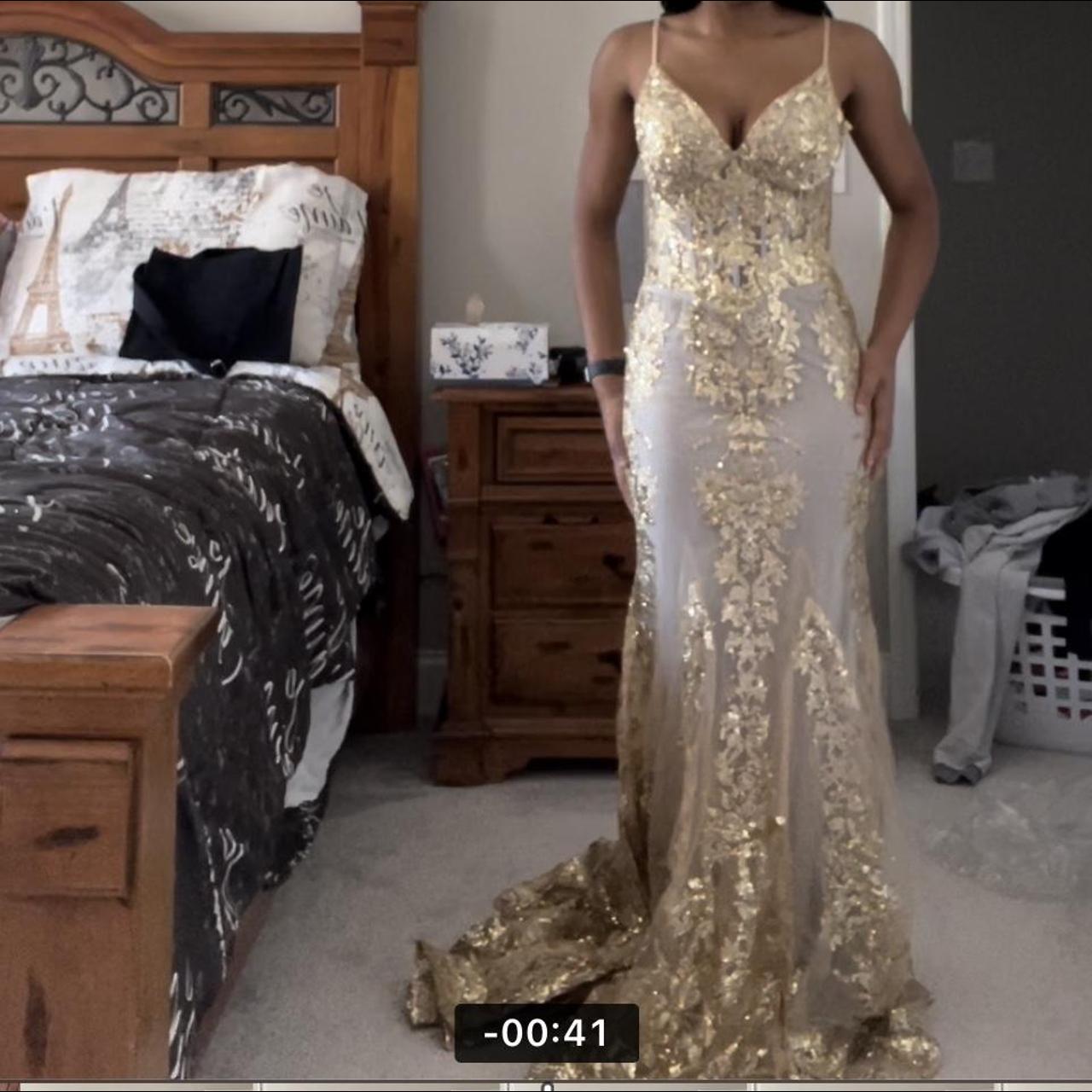 lady black tie gold dress