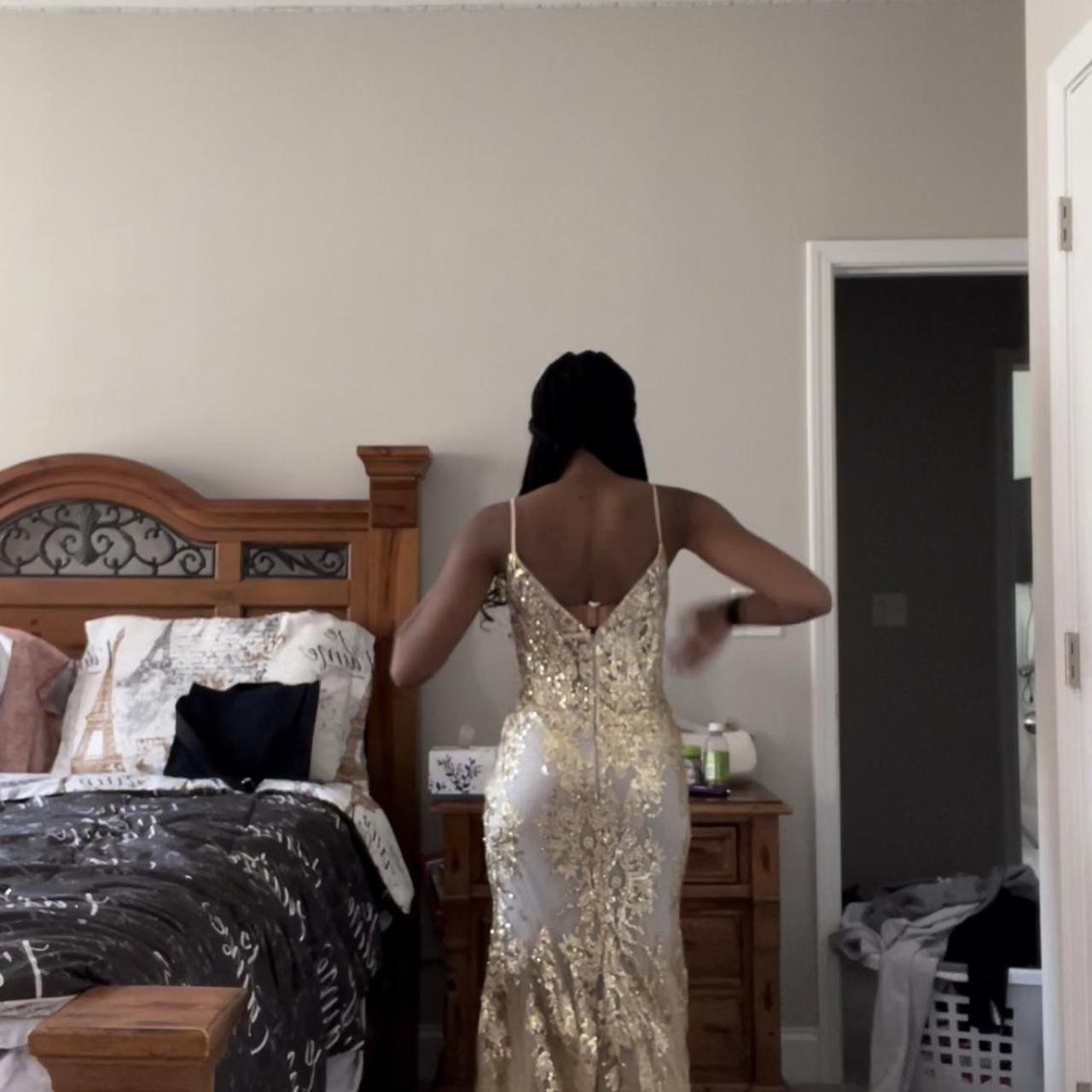 lady black tie gold dress