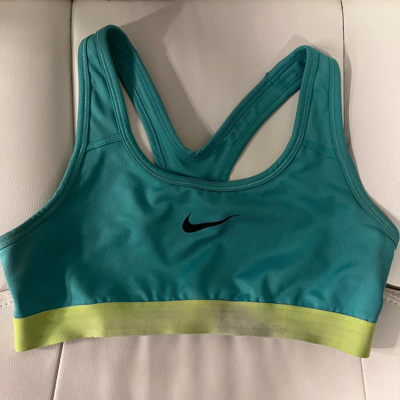 Nike sports bra, lightly used with fading on the front - Depop