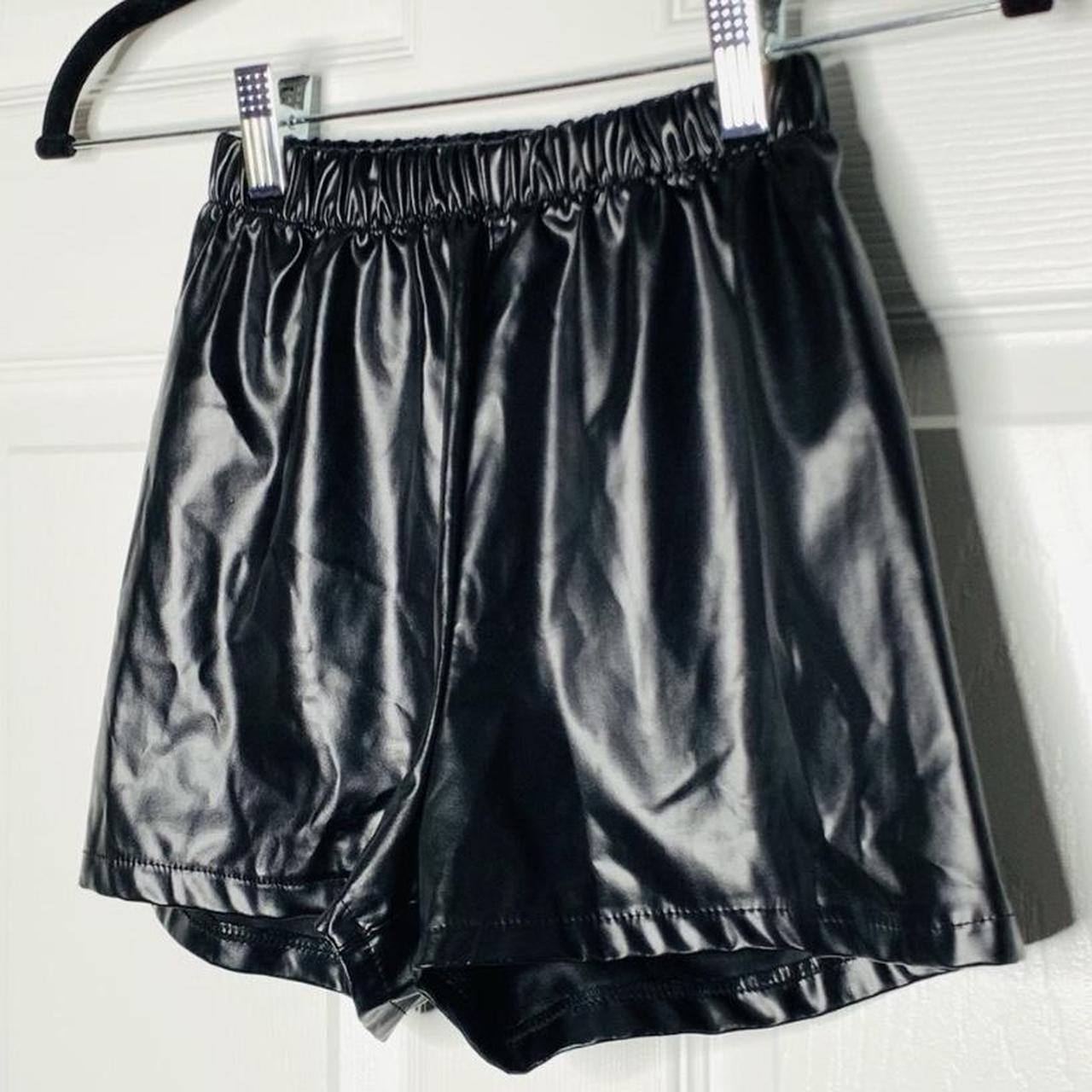 Faux leather shorts. No size tag and has a tights... - Depop