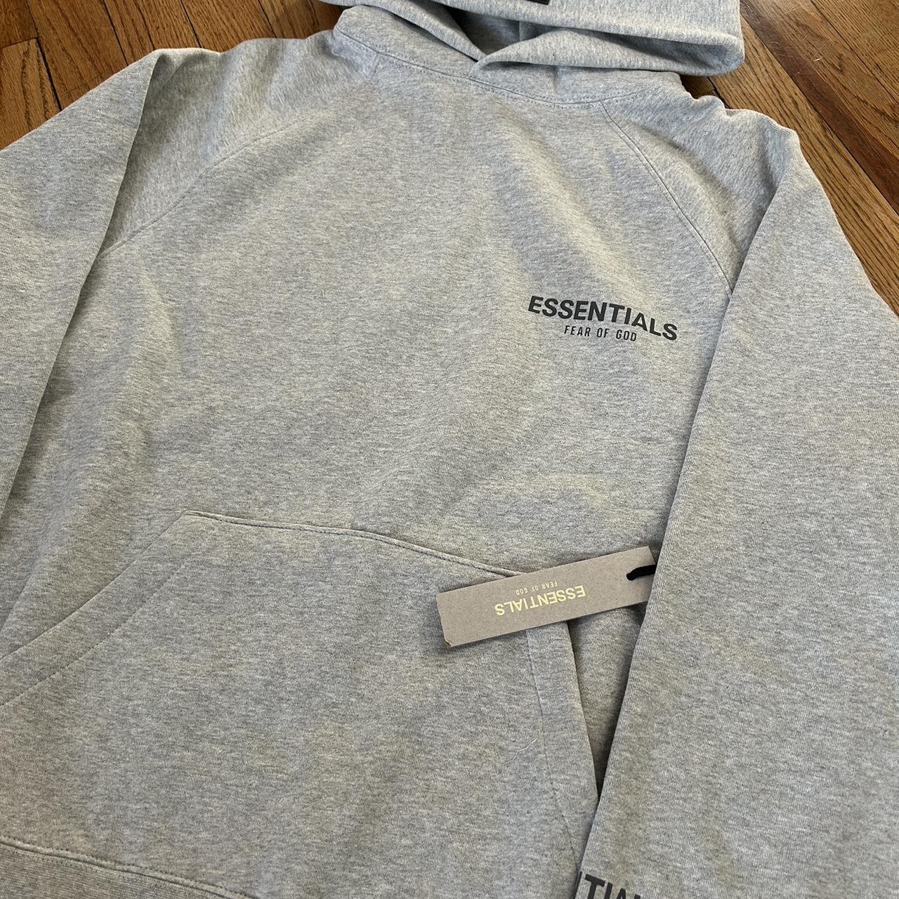 Essentials hoodie dark gray - Depop