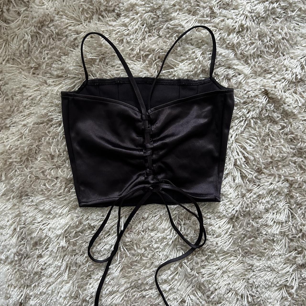Black silky spaghetti strap corset top. Laces up in... Depop