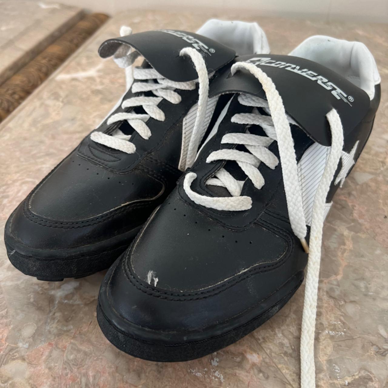 Black converse cleats best sale