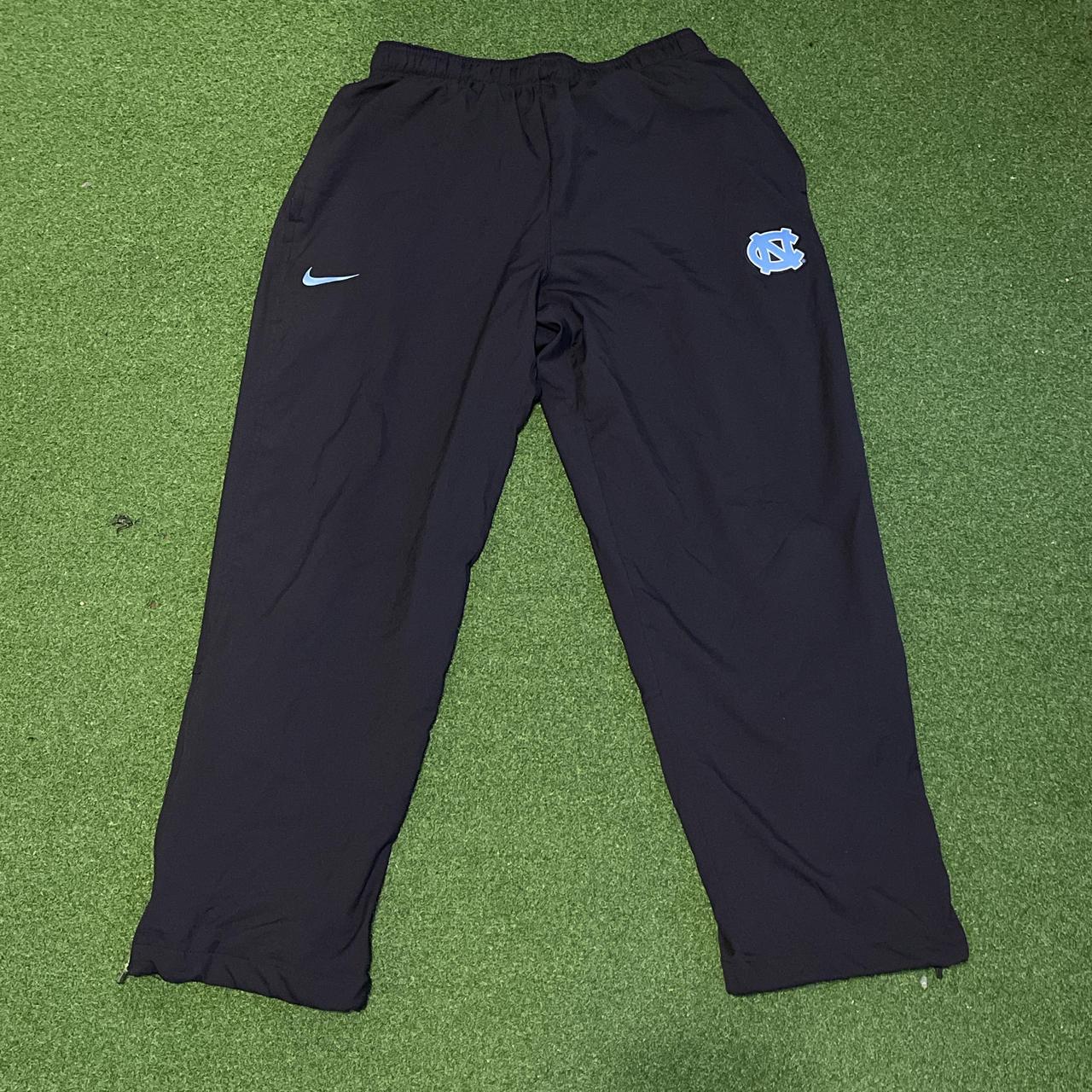 nike track pants with zip pockets