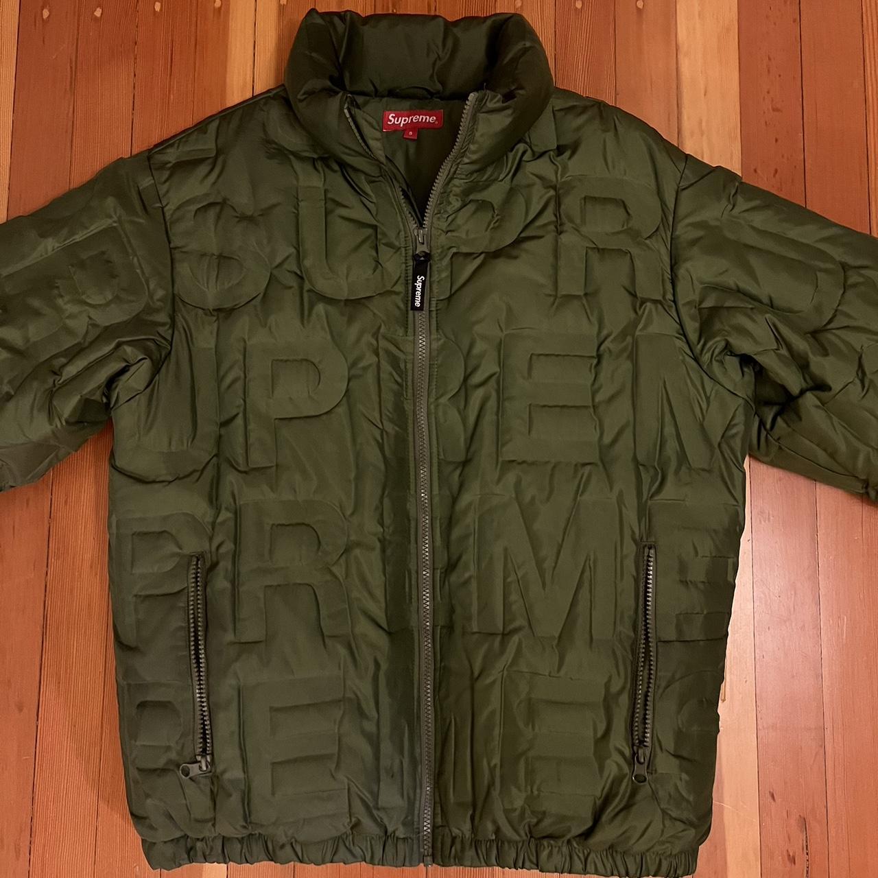 SUPREME Bonded Logo Puffy Jacket. This coat blends...