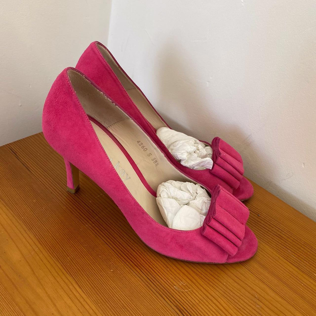 Hot pink suede heels with a bow detail on the Depop