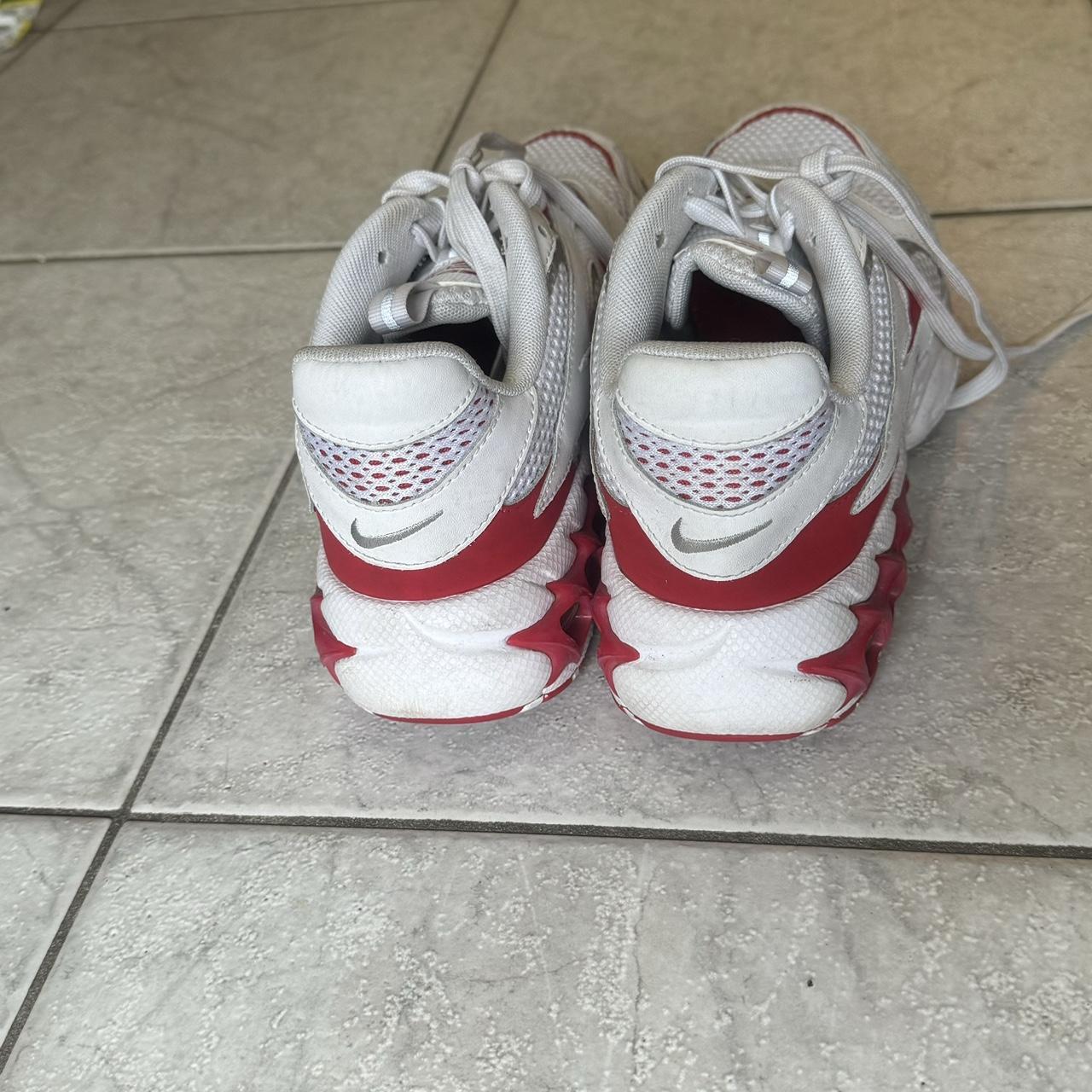 nike red and white tennis shoes