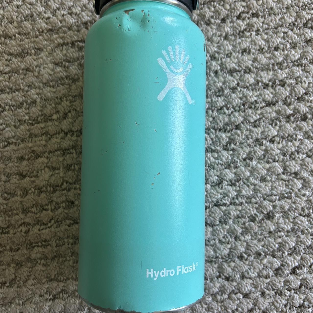 Hydro Flask water bottle with a few scuffs and dents