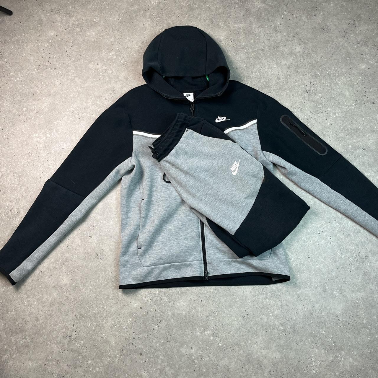 grey and black tech fleece the top is in perfect... Depop