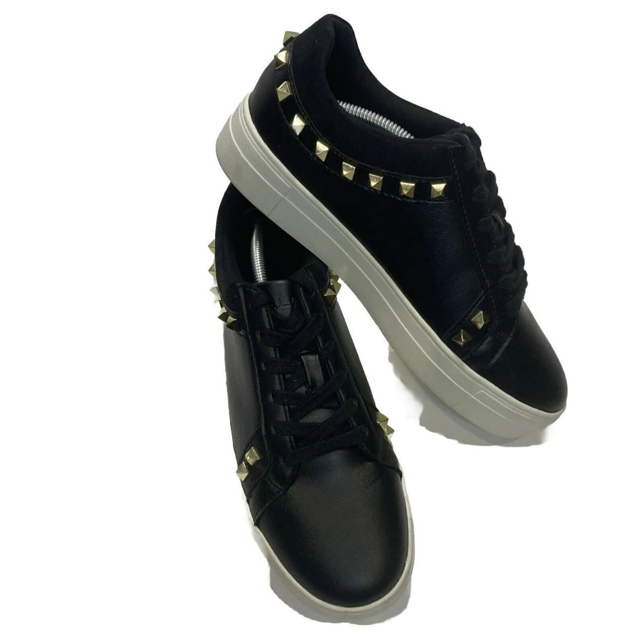 Shops black studded trainers