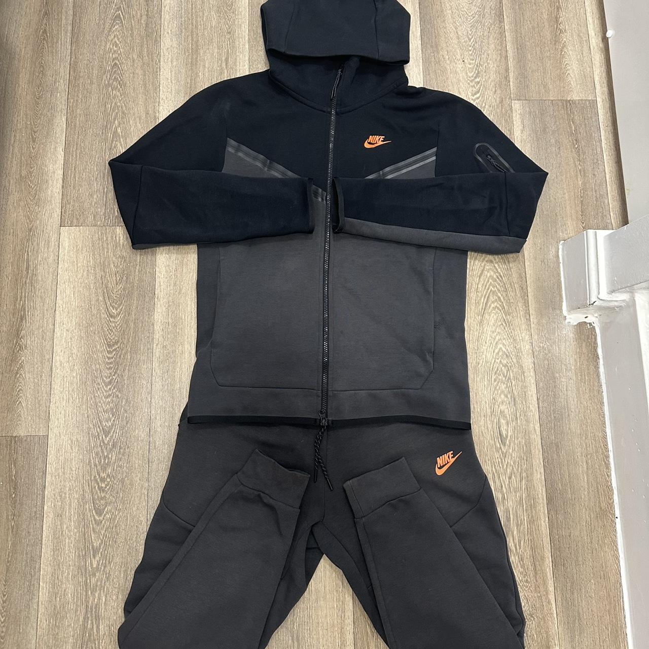 orange and black nike tech