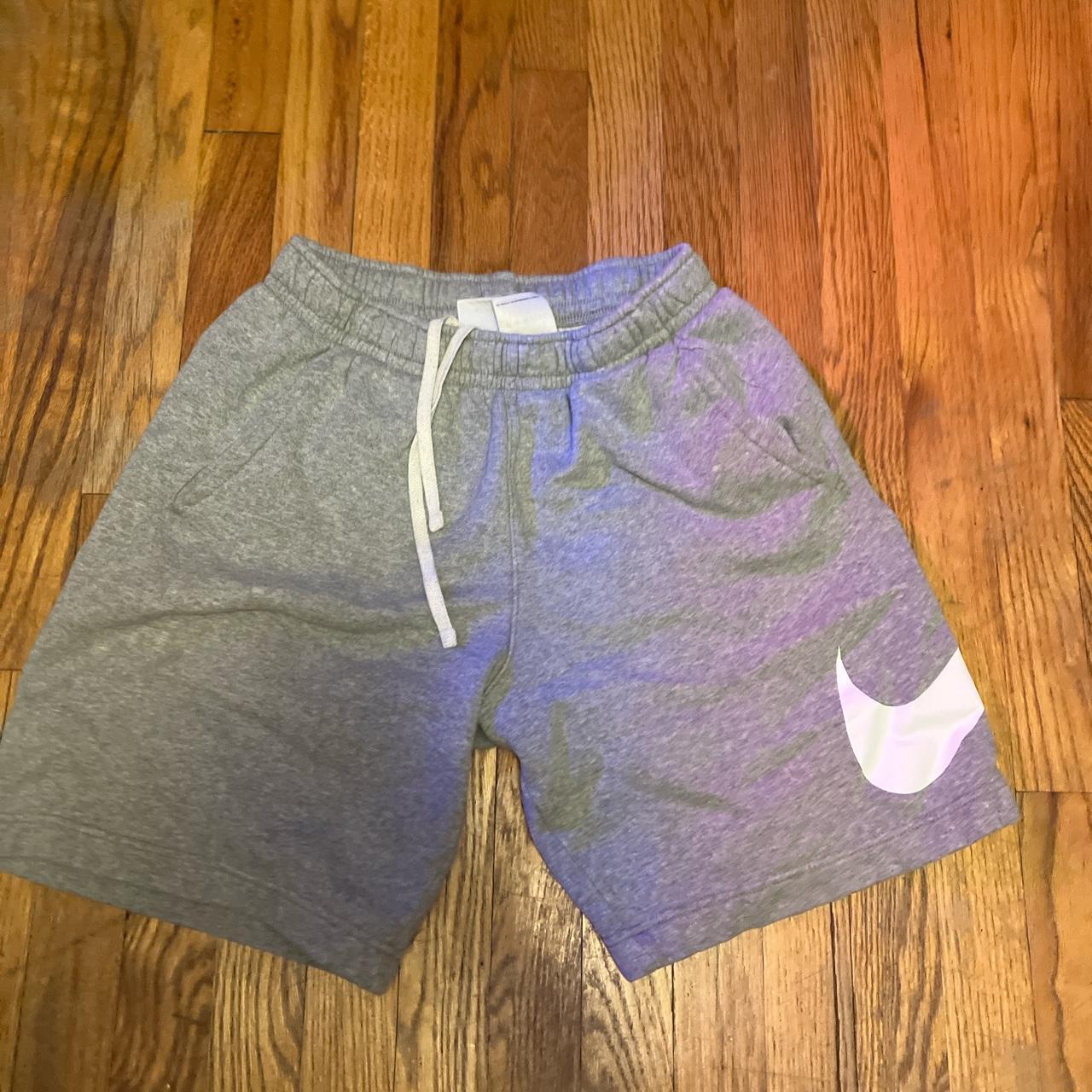 grey nike fleece shorts, w swoosh logo - Depop