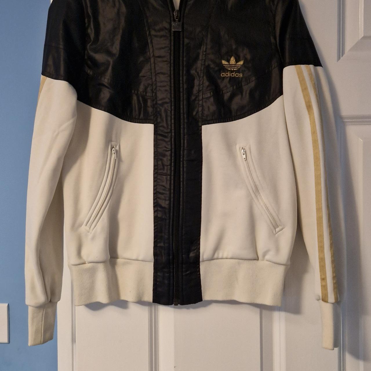 Adidas originals black and gold jacket deals