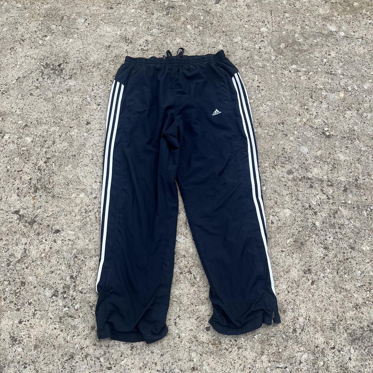 Adidas navy track pants size L small cut on the knee - Depop