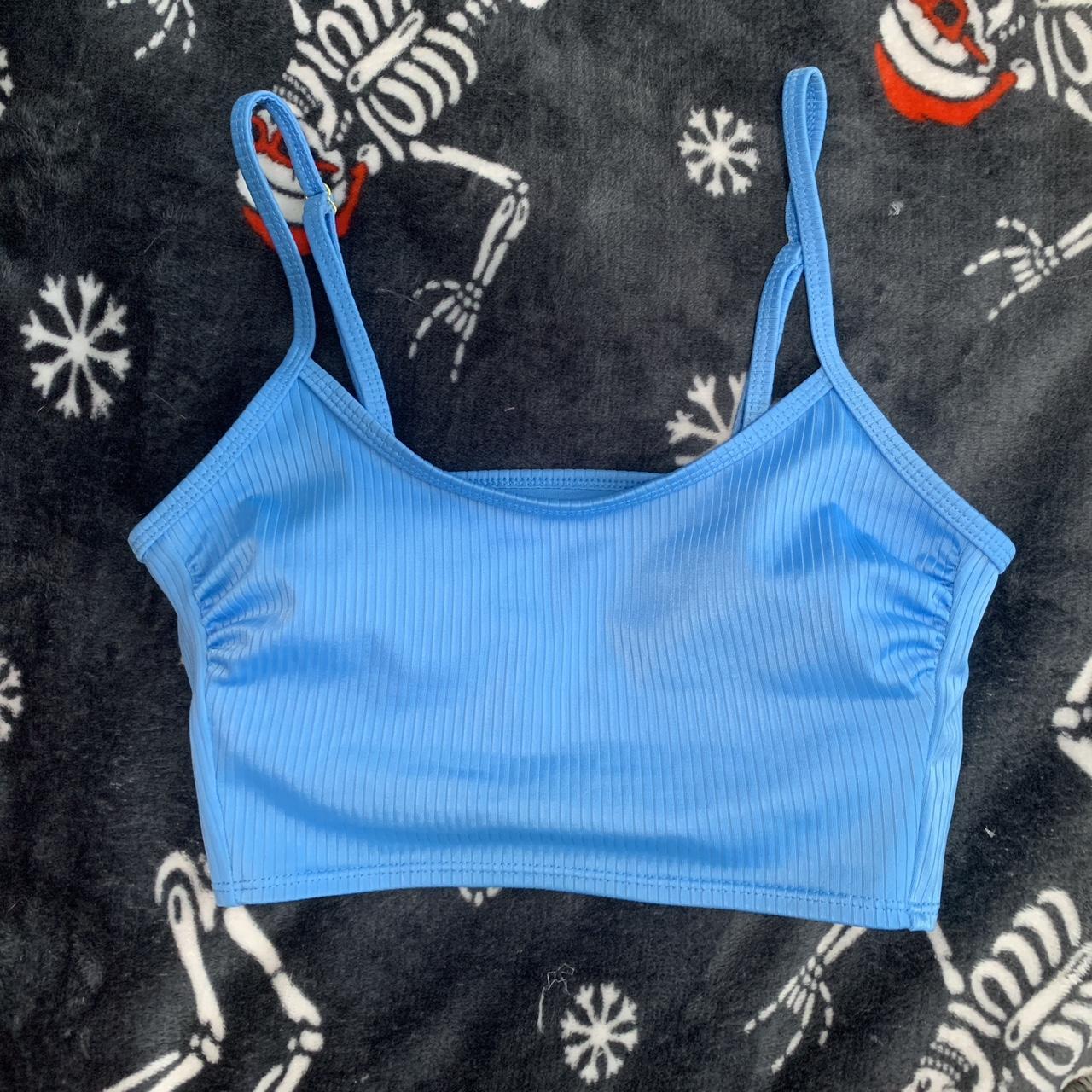 light blue ribbed swimsuit top with ruched detail...