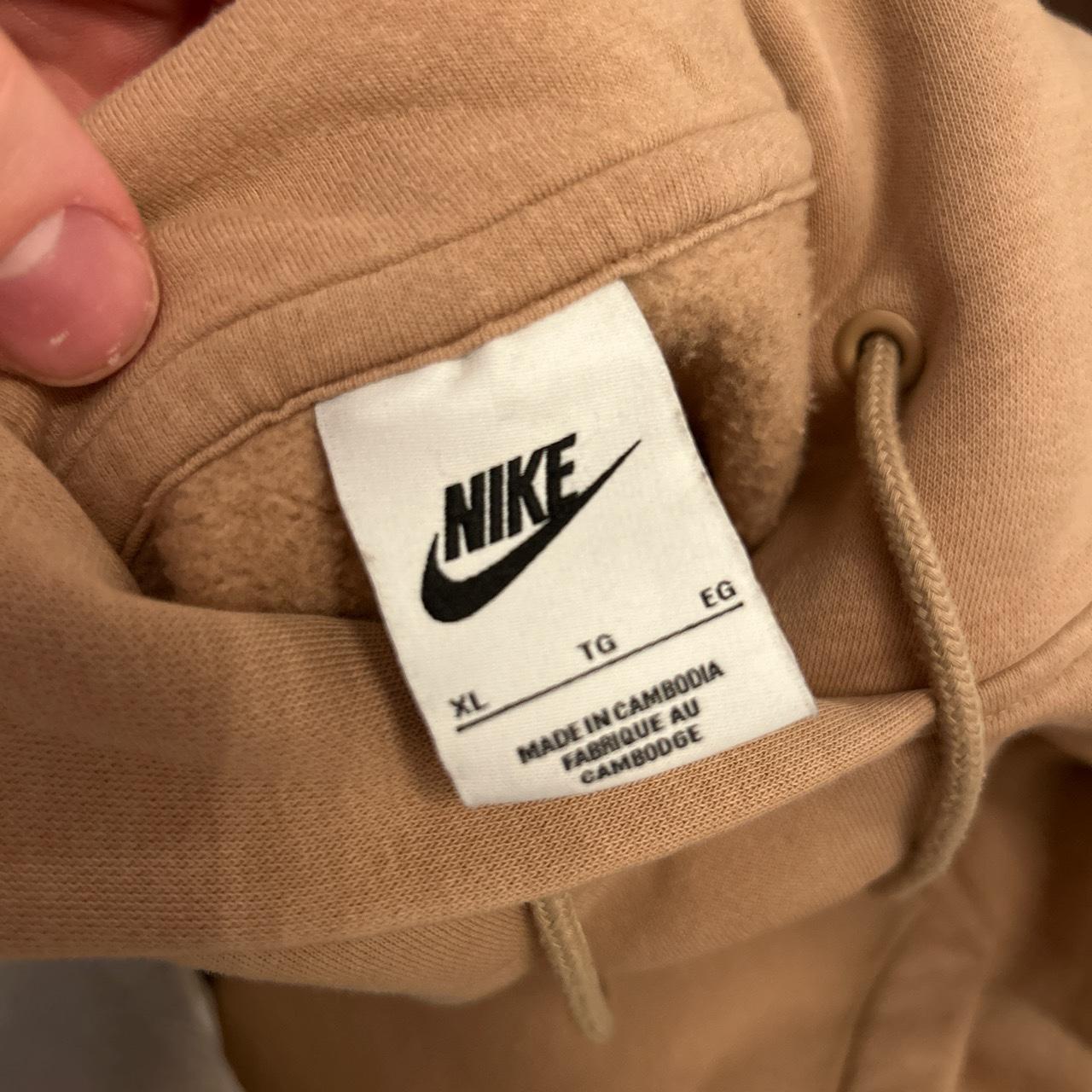 Tan Nike center swoosh hoodie great condition Pit to Depop