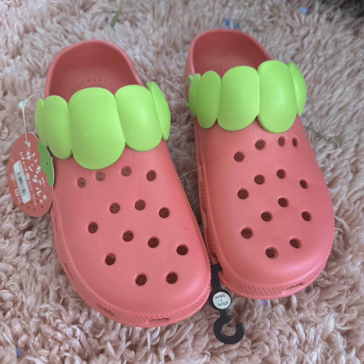 strawberry crocs with tags could fit a
