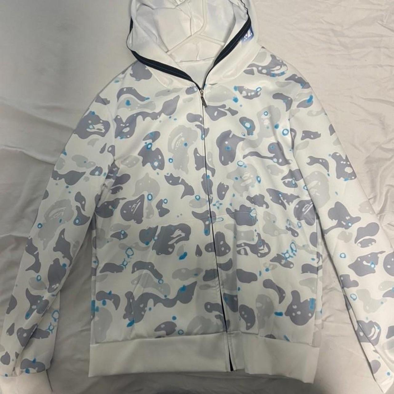 White and camo blue hoodie with a bape logo on the... - Depop